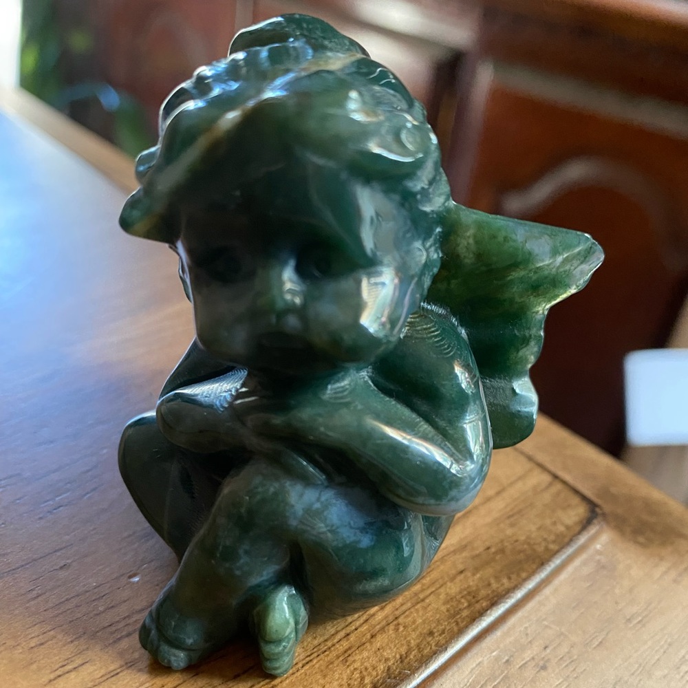 Beautifully carved moss agate cherub